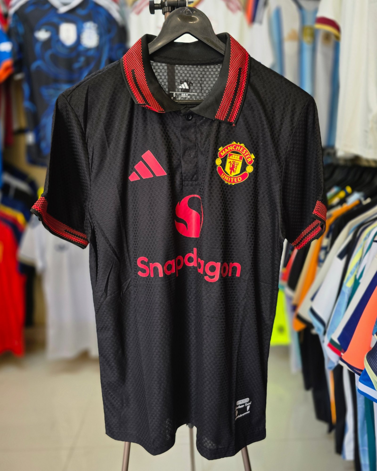 MANCHESTER UNITED BLACK POLO JERSEY 2026