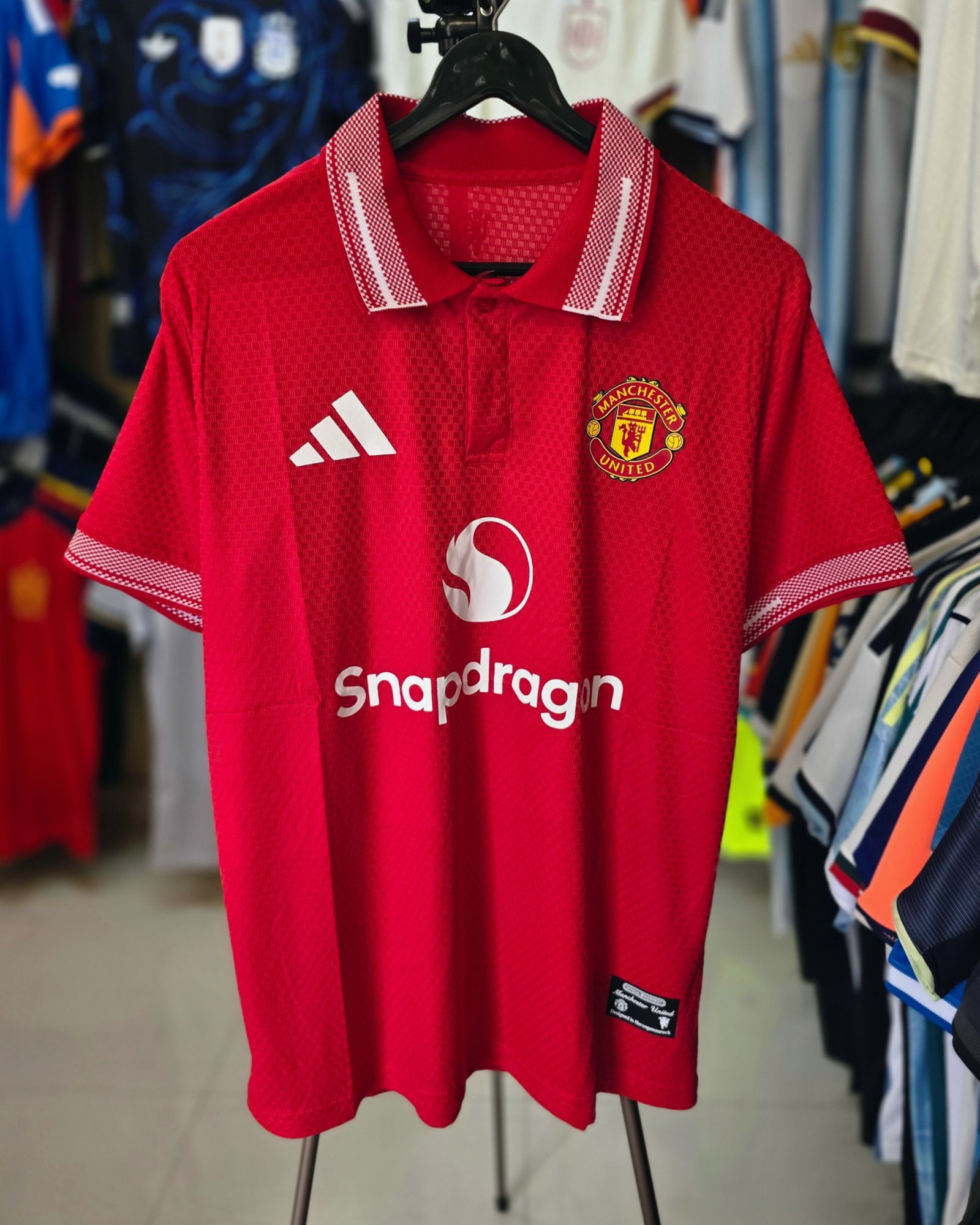 MANCHESTER UNITED RED POLO JERSEY 2026